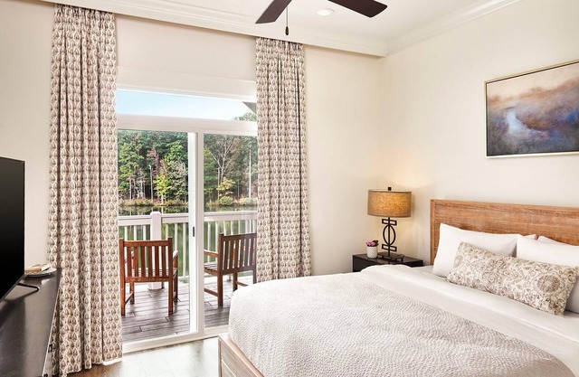 Two-Story Villa Overlooking Lunker Lake w/Kitchenette, WiFi, & Covered Porch