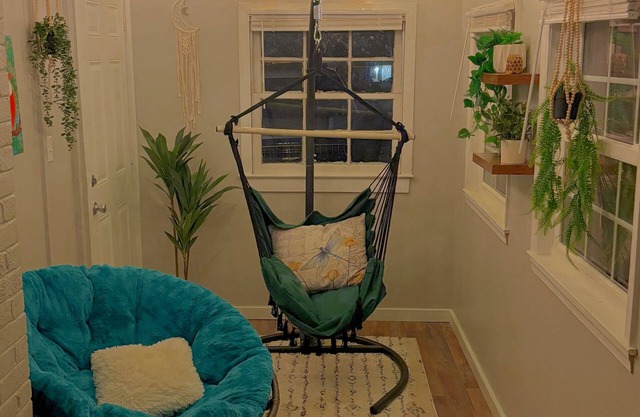 Updated 4-bedroom house with relaxing sunroom; minutes from downtown Raleigh.