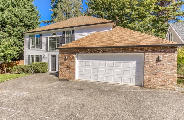 Updated home next to a park with fenced yard, deck, grill, & W/D