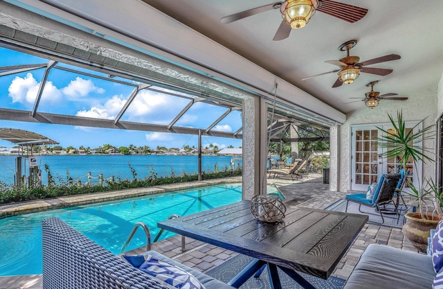 Upscale lakefront home w/private saltwater pool, dock, free WiFi, & central AC