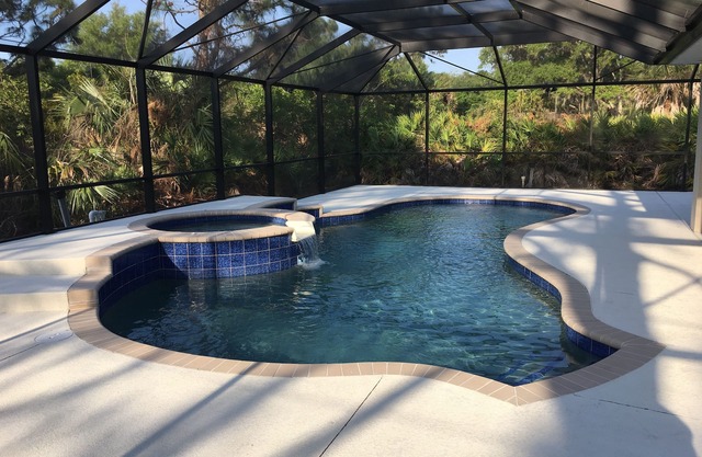 VERY NICE HEATED POOL HOME LIKE NEW