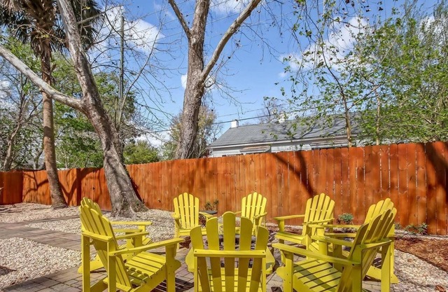 Vibrant, Colorful Condo Building With Backyard Firepit and Games