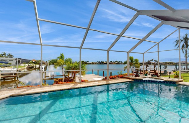 Villa Aasta | Luxe Lakefront Outdoor Living | Screened Pool, Game Room & Dock