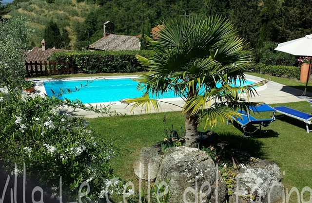 Villa in a hilly area surrounded by greenery with swimming pool and breathtaking views