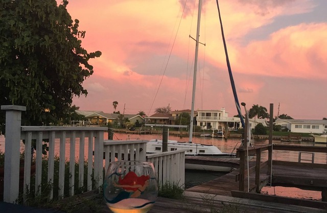 Watch sunsets from waterfront deck of 3,000 sq-ft. home in Tampa Bay beach town!