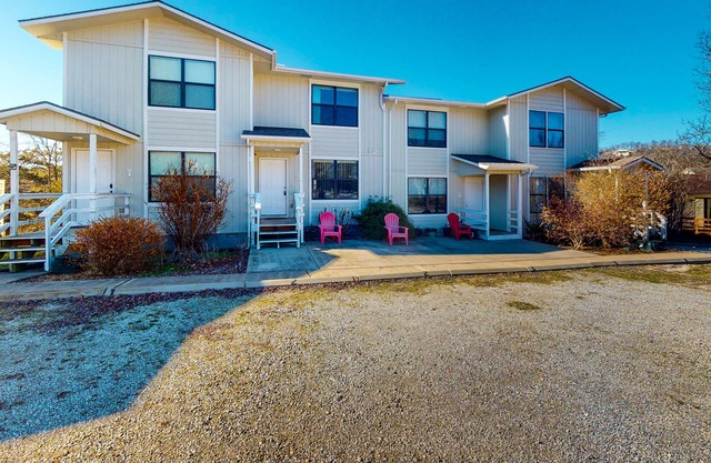 Water view townhouse with a washer/dryer, central AC, yard & grill