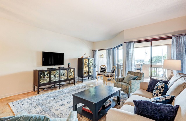 Waterfront condo with walkable locale, central AC, washer/dryer, & shared pool