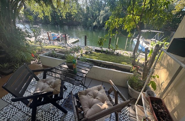 Waterfront Condo with Fishing, Paddleboard, and yard access.