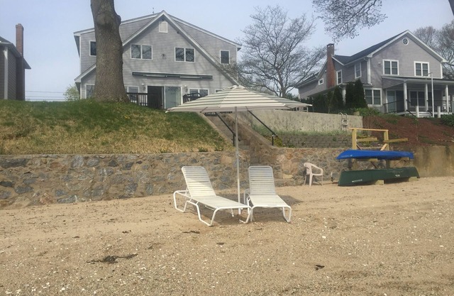 Waterfront home with private sandy beach on Niantic River.