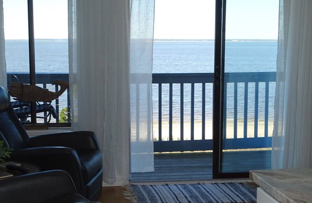 Waterfront! Top floor, corner unit. Beautiful beach & water views!