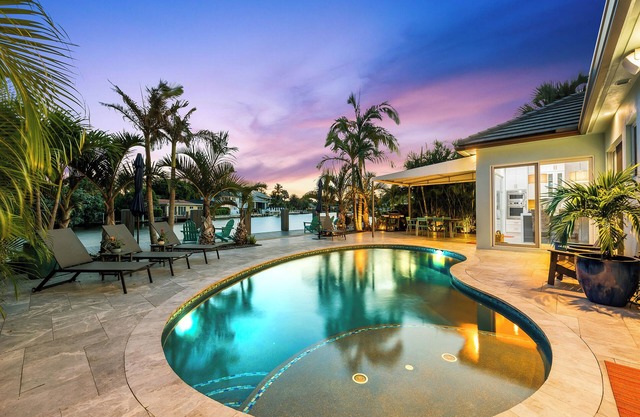 Welcome to the Bahama Breeze, A Sunny Waterfront Heated Pool Home!