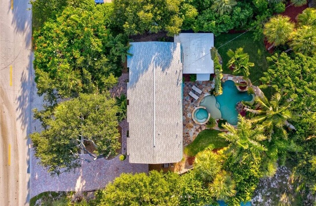 Welcome to your tropical oasis steps from the beach!