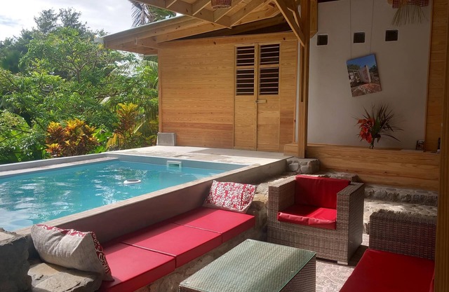 Wood and stone bungalow with swimming pool
