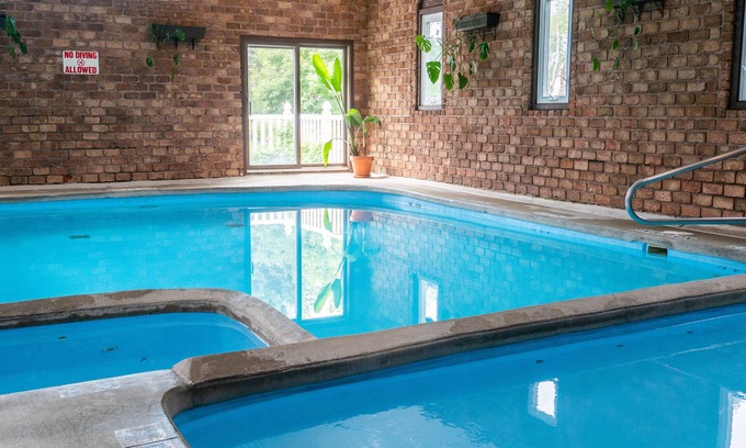 Fennville Cabin | 18 units for 10-70 people:18 baths. Indoor POOL/pickleball/volleyball/playground