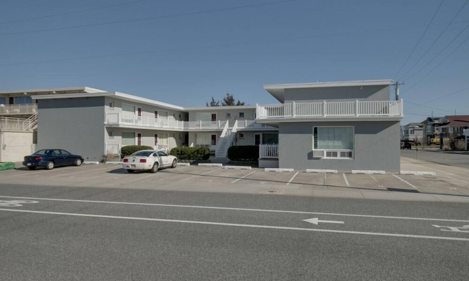 Stone Harbor Condo | 1st Floor Front Efficiency Unit, right side, corner Tables and chairs in the court yard.