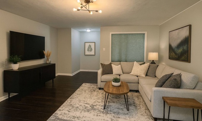 Michigan City House | 🛏 2 cozy bedrooms (1 King & 1 Queen) and 1 bathroom 🍳 Spacious kitchen stocked for cooking and dining in 🛋 Large living room for lounging after a long day. 🚗 Garage parking and easy access to town 🐶 Dog Friendly with Fully Fenced Ya