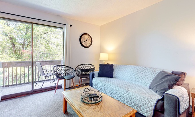 Weirs Beach Condo | 2nd-Floor condo with a private balcony, on-site beach, outdoor pool, laundry