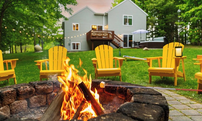 Traverse City House | 4bdr 2 bath house. Unwind in the hot tub, chat around the fire pit and disc golf