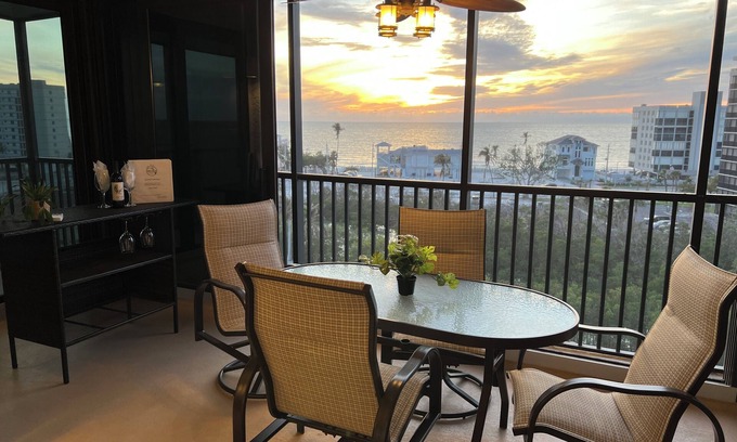 Bonita Springs Condo | 7th HEAVEN! Stunning views! Heated Pool, Pickle Ball! Across from Bonita Beach!