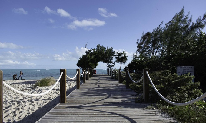 Long Bay Hills Cottage | A Kiteboarders Dream complete with a Pickle Ball Court and a Pool!