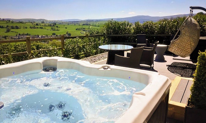 Corwen Cottage | A stunning barn conversion with hot tub, great views and a very comfy kingsize bed.