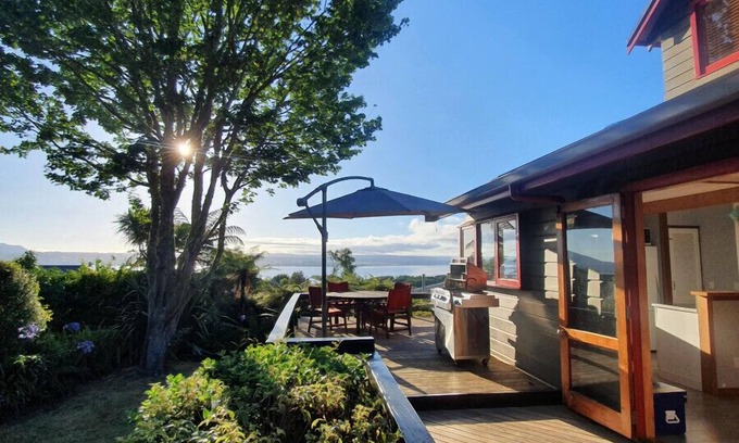 Acacia Bay House | Acacia Bay Retreat | Stylish Family Getaway with Fireplace & Lake Views