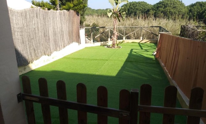 Islantilla Apartment | Adosado con jardín en urbanización con piscina