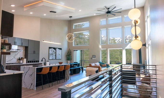 Girdwood House | Alaskan airplane hanger inspired home with mountain views, WiFi, & deck