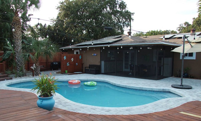 Crooked Creek House | Amazing home with heated pool, tiki bar and luscious outdoor close to beaches