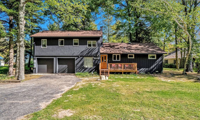 Lake Township House | Amazing riverfront retreat with firepit, patio, W/D, & great views