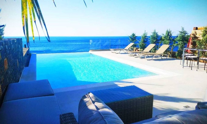 Pefki Villa | An exquisite and luminous seaside villa. The epitome of coastal serenity.