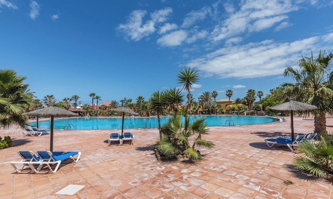 Corralejo Apartment | Apartment "Fuerteventura Harmony" with Mountain View, Terrace, Shared Pool & Wi-Fi
