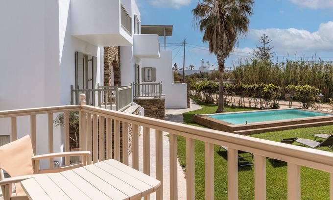 Kionia Apartment | Apartment In A Hotel 'Ninemia Suites Tinos Grand 105' with Shared Pool, Wi-Fi and Air Conditioning