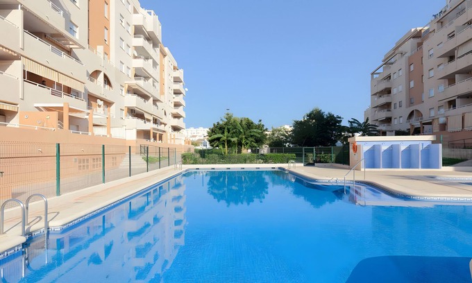 Grao de Gandia Apartment | Apartment 'Jardines De Playa Gandia' with Shared Pool, Wi-Fi and Air Conditioning