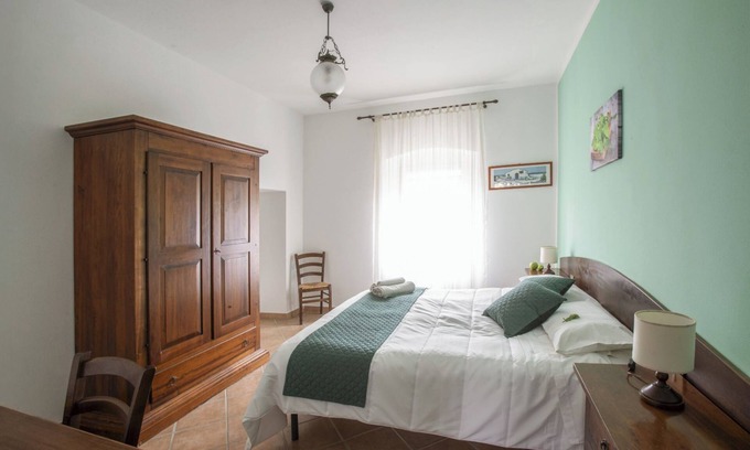 Rosignano Marittimo Apartment | Apartment 'Menta' with Shared Pool and Garden