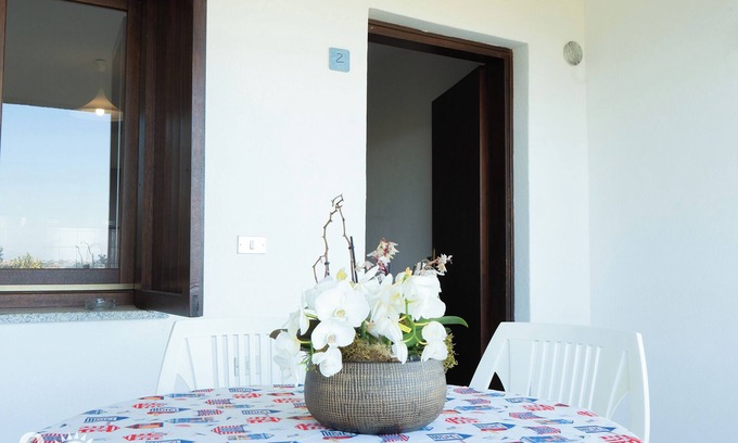 Budoni Apartment | Apartment 'Malamuri 2' with Shared Pool, Shared Garden and Wi-Fi