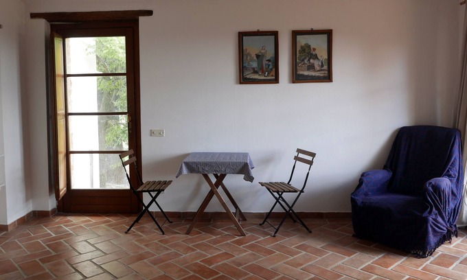 Seggiano House | Apartment with double bed, bathroom, small kitchen and large terrace.