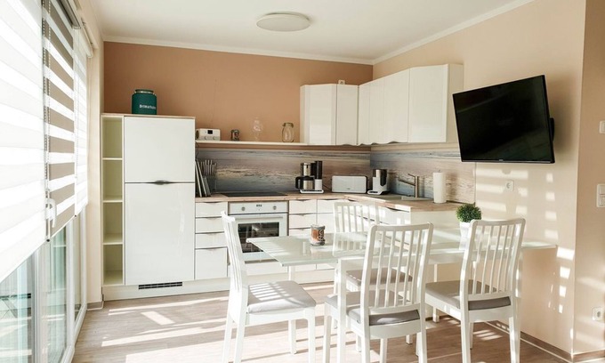 Gelbensande Apartment | Attractive vacation apartment with private garden and barbecue