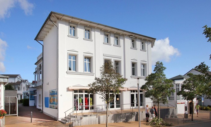 Gohren Apartment | Balcony, free use of the AHOI adventure pool and sauna -Residenz Strandeck FeWo01
