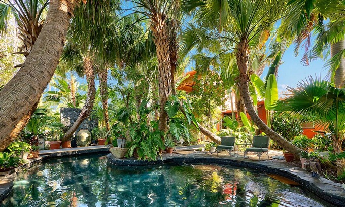 Parrot Cove House | Bali Inspired Home on Golf Course- 4 Bedroom + Heated Lagoon Pool!