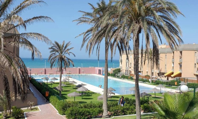 Retamar Apartment | Beachfront Apartment with Swimming Pool, Sports Courts and Capacity for 4 Persons