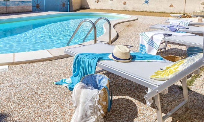 Trinita d'Agultu Apartment | Beautiful apartment for 6 people with WIFI, A/C, pool, TV and patio