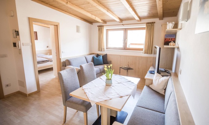 Rasa Apartment | Beautiful attic apartment with south-facing balcony, view of the Plose/Brixen/apple orchards