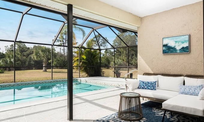 Rural Estates Villa | Beautiful Canal Front Home with Pool, Tennis Court