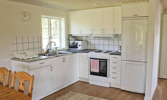 Vittsjo House | Beautiful cottage with fireplace for cool evenings.