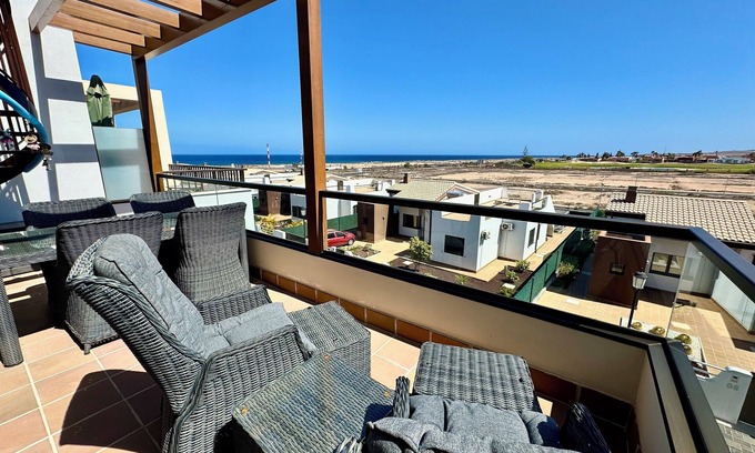 Caleta de Fuste Apartment | Beautiful south facing penthouse apartment with amazing views in Caleta de Fuste