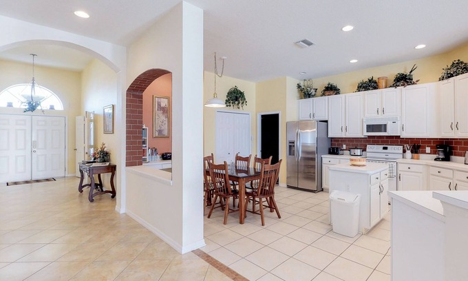 Sabal Harbour House | Beautiful Waterside Home with a Private Pool, Spa, and Lake Views