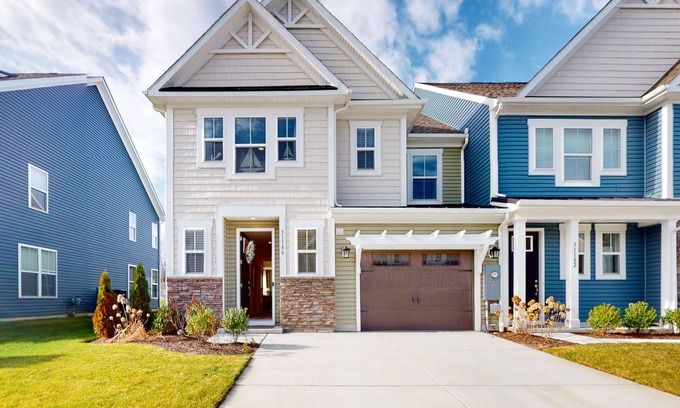 Millville House | Bishop's Landing townhouse with grill, outdoor pool, gym, tennis court, shuttle