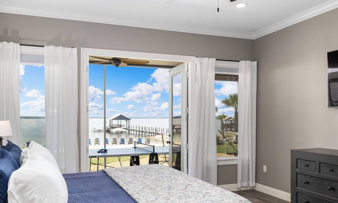 Candler House | Blue Haven on Lake Weir with white sandy beach and fishing off of the dock