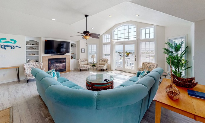 Sandbridge House | Bright & open waterfront home with private pool, sunset views, decks & elevator